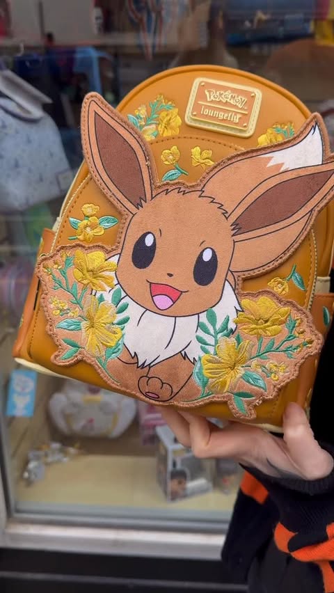 Instagram post by @attackonmew for loungefly. Caption reads: The Pokemon loungefly collection grows again....