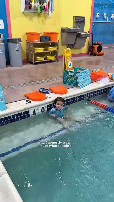 Instagram post by @themodernlatinamama for Goldfish Swim School. Caption reads: [...] So proud of this little fish 🐠 -....