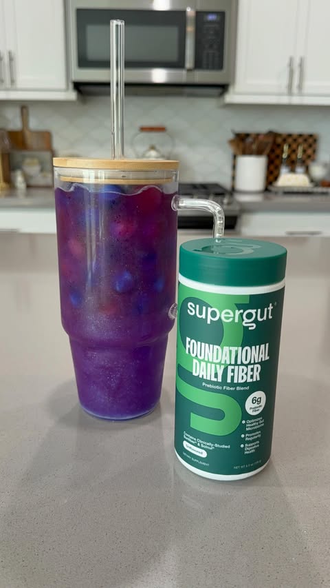 Instagram post by @thedailyammie for Supergut. Caption reads: Now this is a loaded water 🩷💙🩷💙 @supergut....