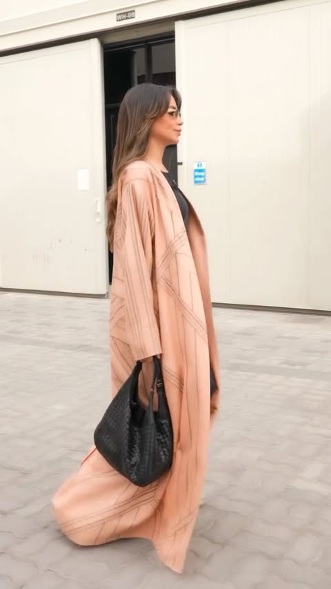 Instagram post by @zeynabelhelw for DAMAC Properties. Caption reads: Living in the UAE means being part of something....