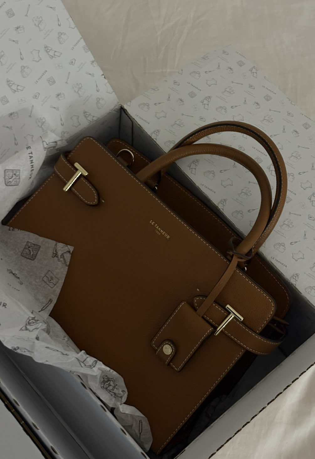 TikTok post by @sonnyyyxo for Le Tanneur. Caption reads: [...] with the blue details🥹 merci @Le Tanneur....