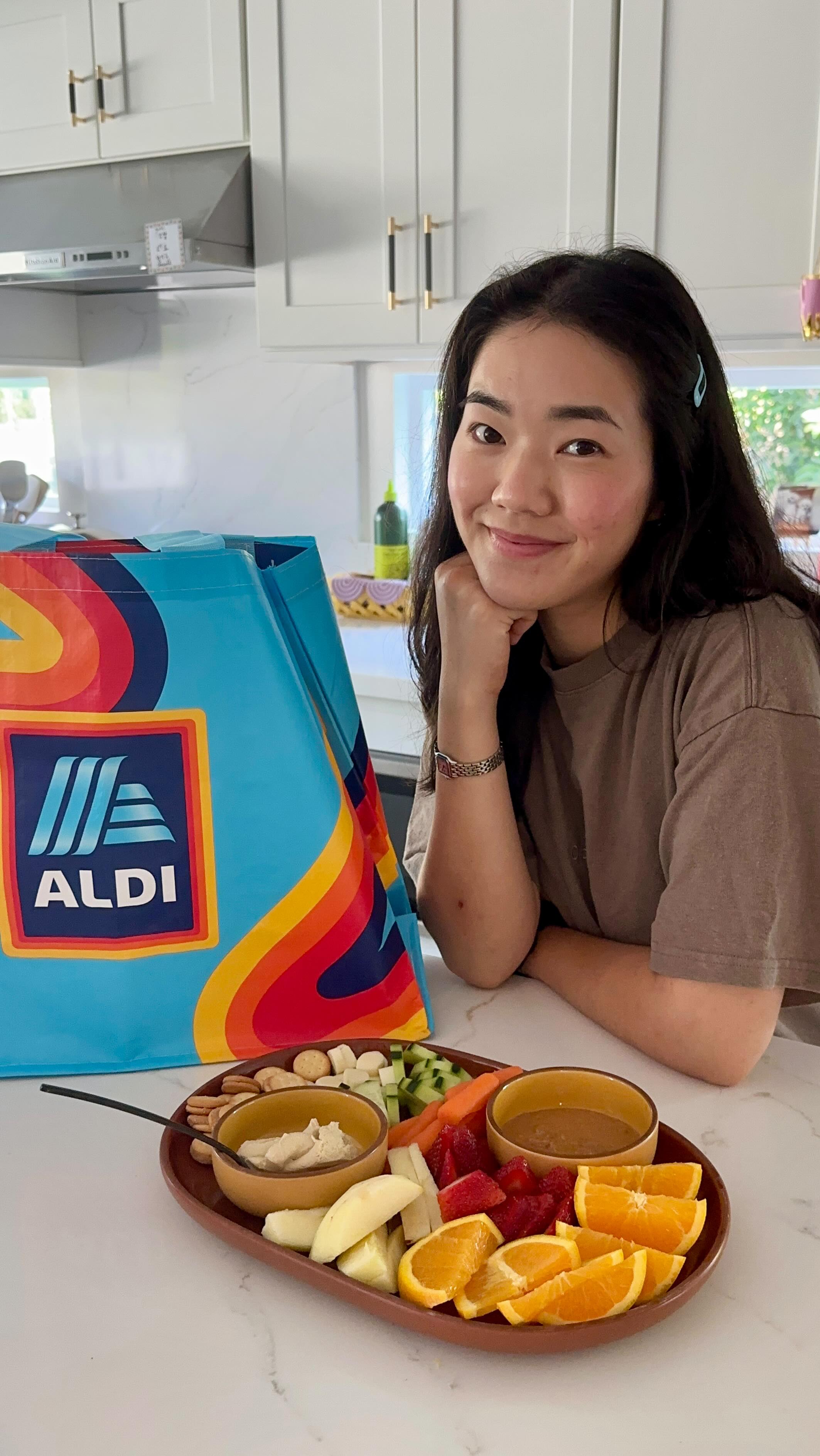 Instagram post by @jasmnekim for Aldi. Caption reads: #ALDIPartner Big milestones like the first day of....