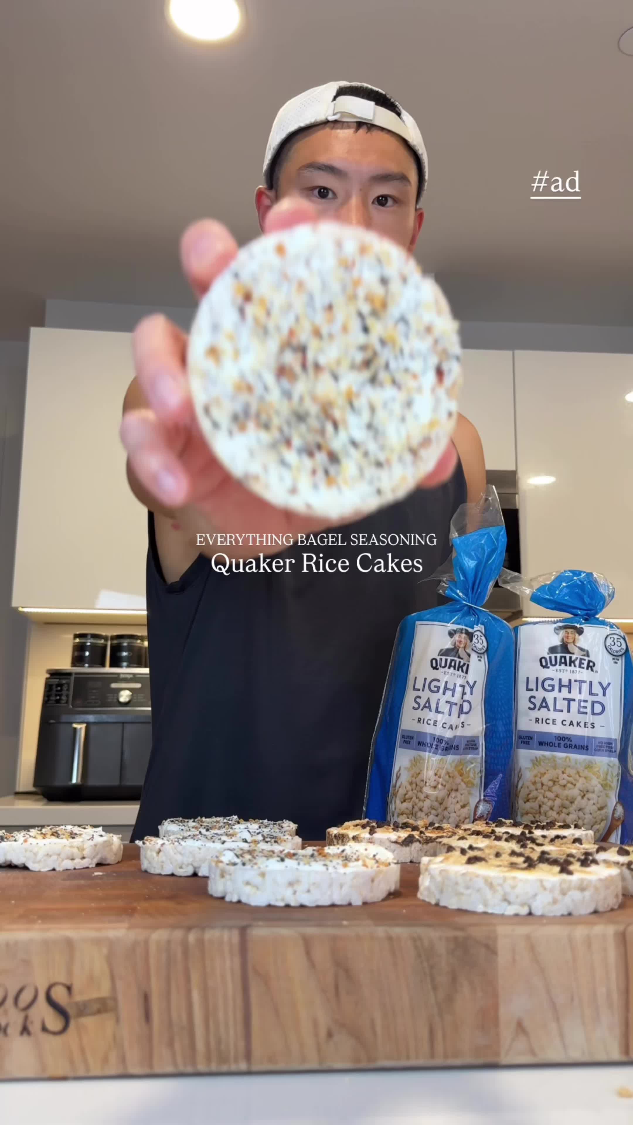 TikTok post by @cooklikeimbook for Quaker Oats. Caption reads: #ad Everything Bagel & S’mores rice cakes! I love....