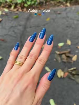 TikTok post by @nailsbysmf for DND Gel. Caption reads: The perfect autumn blue 🧵🍂👖 Using @DNDGel Blue....