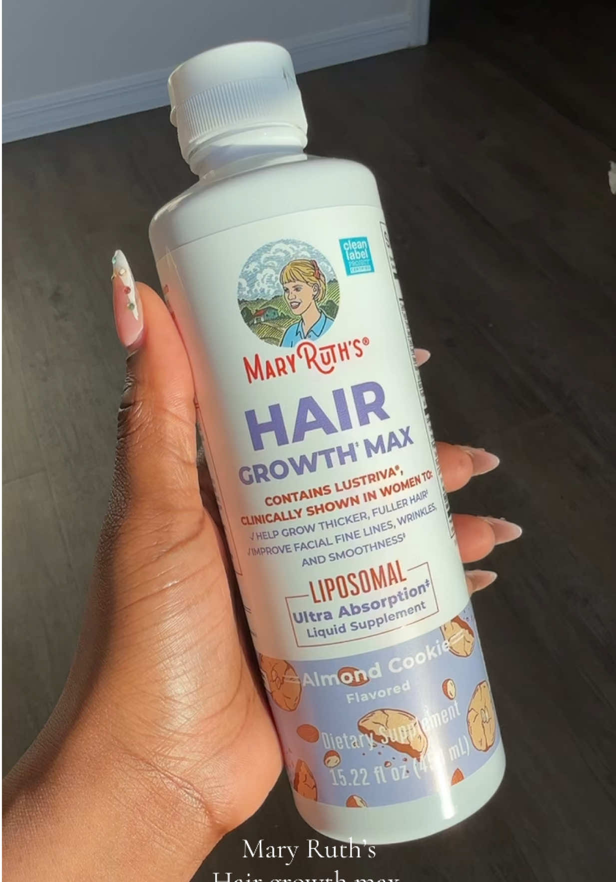 TikTok post by @itsmikenlove for MaryRuth Organics. Caption reads: I love this hair growth liquid supplement....