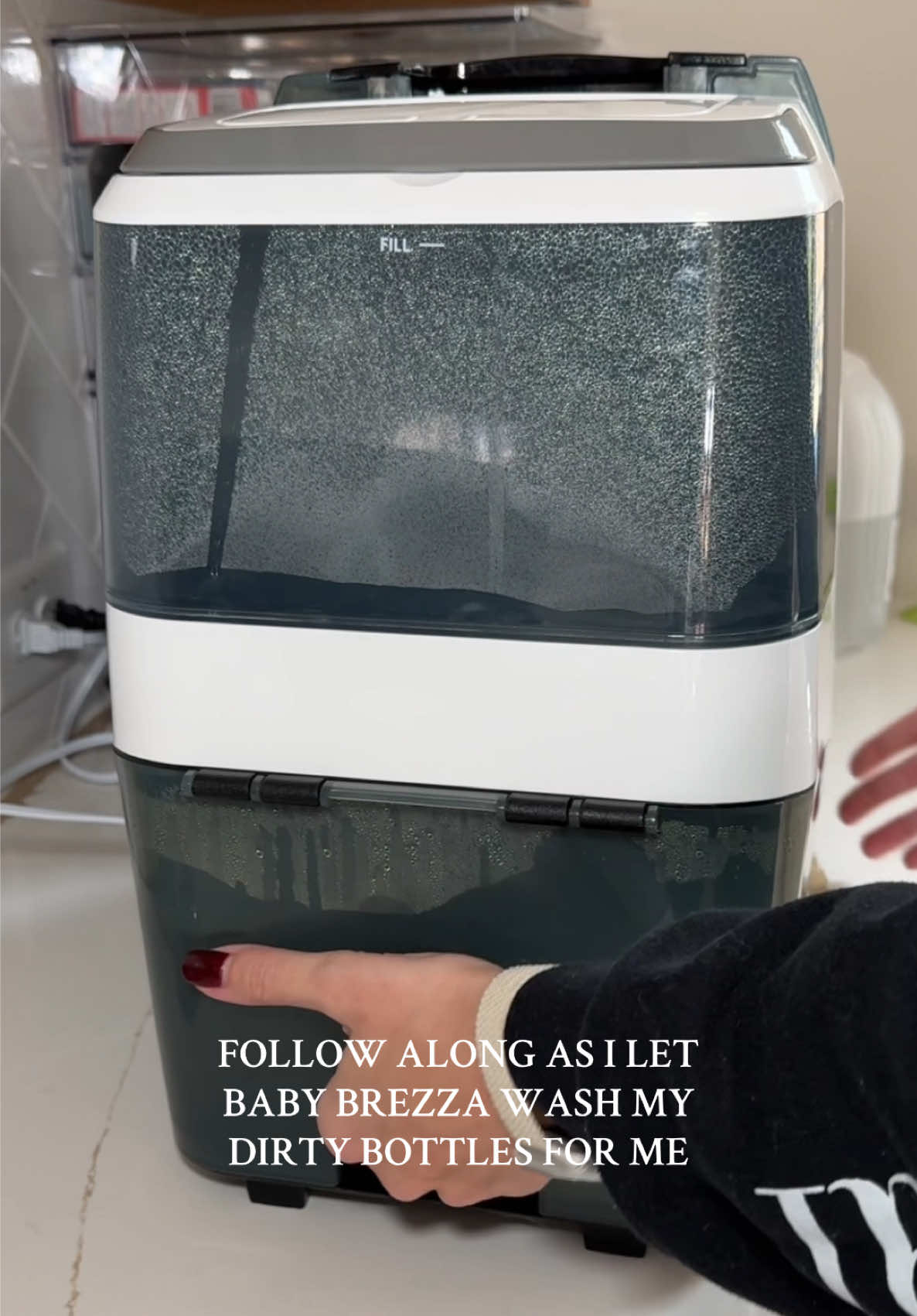 TikTok post by @ashleybechter for Baby Brezza. Caption reads: Baby Brezza making mom life easier with [...].