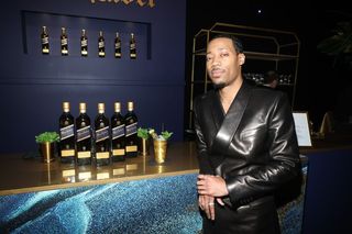 Instagram post by @tylerjameswill for Johnnie Walker US. Caption reads: #ad @johnniewalkerus Honored to have been....