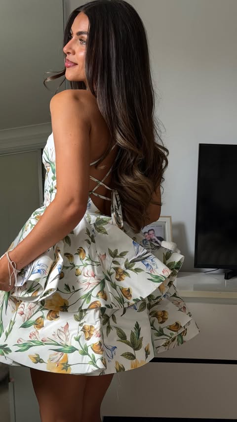 Instagram post by @amberrozario_ for Club L London. Caption reads: [...] most perfect dress ever 🥹🐚🍋🌺🌿....