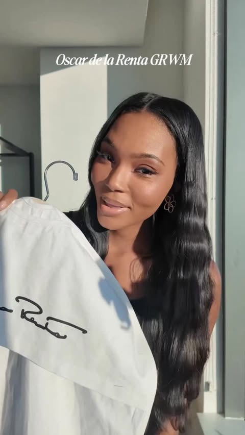 Instagram post by @afiyabennett for Oscar De La Renta. Caption reads: GRWM for @oscardelarenta oscardelarenta 🖤 #nyfw....