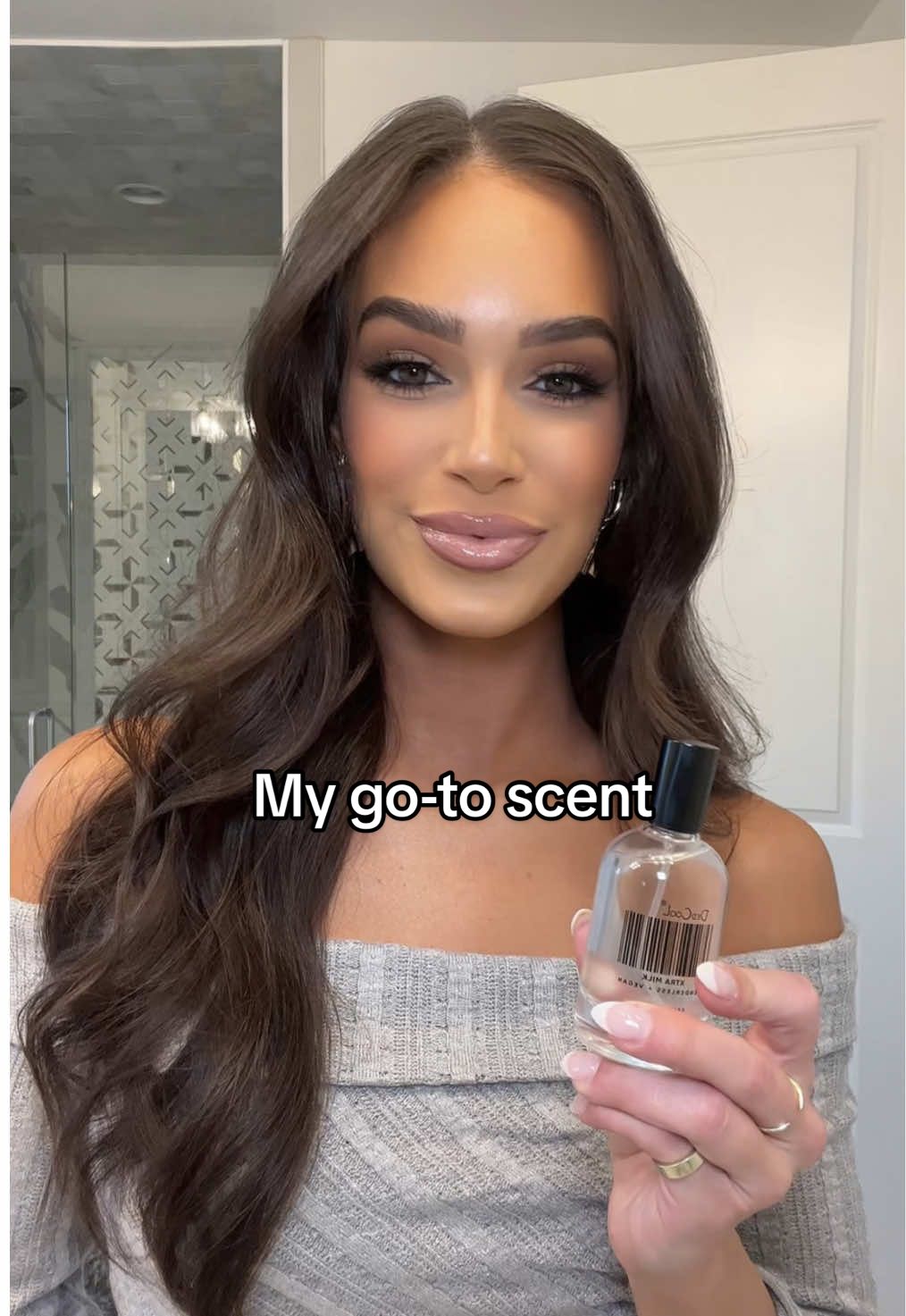 TikTok post by @brooklyn_davis01 for dedcool. Caption reads: The @dedcool Xtra Milk fragrance has been my go-to....