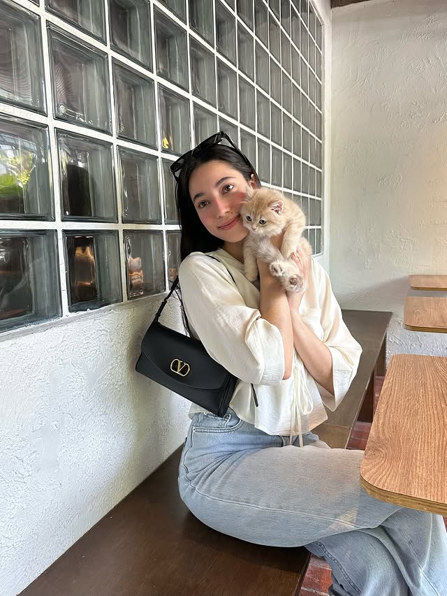 Instagram post by @littlemisskhan for Valentino. Caption reads: date with Lucky @maisonvalentino....