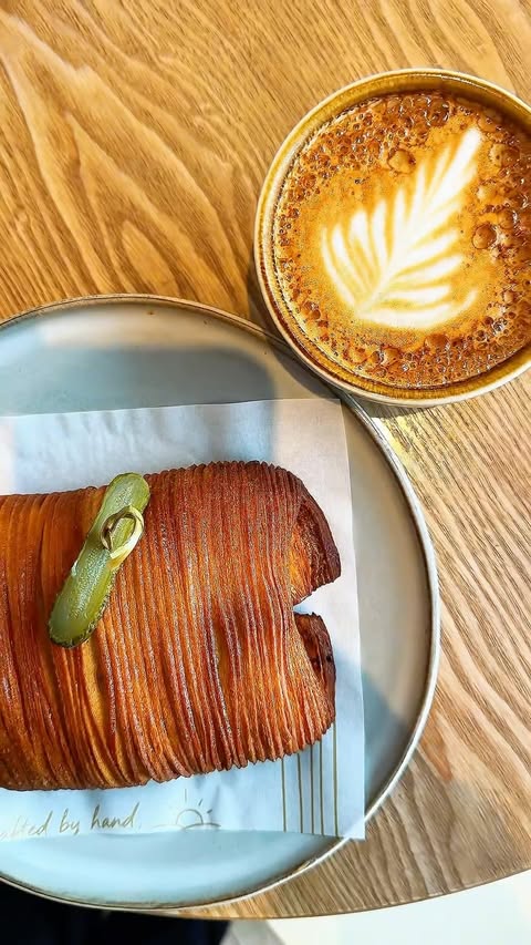 Instagram post by @beauty_with_ju for Invyted. Caption reads: AD - Your sign to visit this London bakery in the....