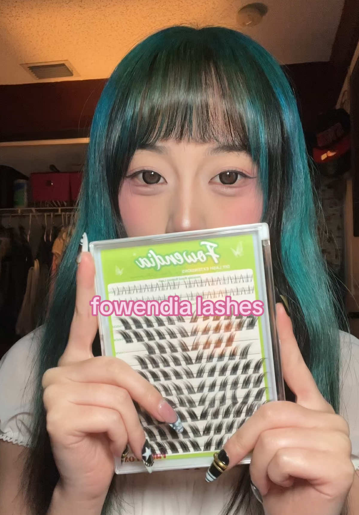 TikTok post by @m0lky for Fowendia Lashes. Caption reads: [...] in orange cart, they’re so cutesy! @Fowendia....