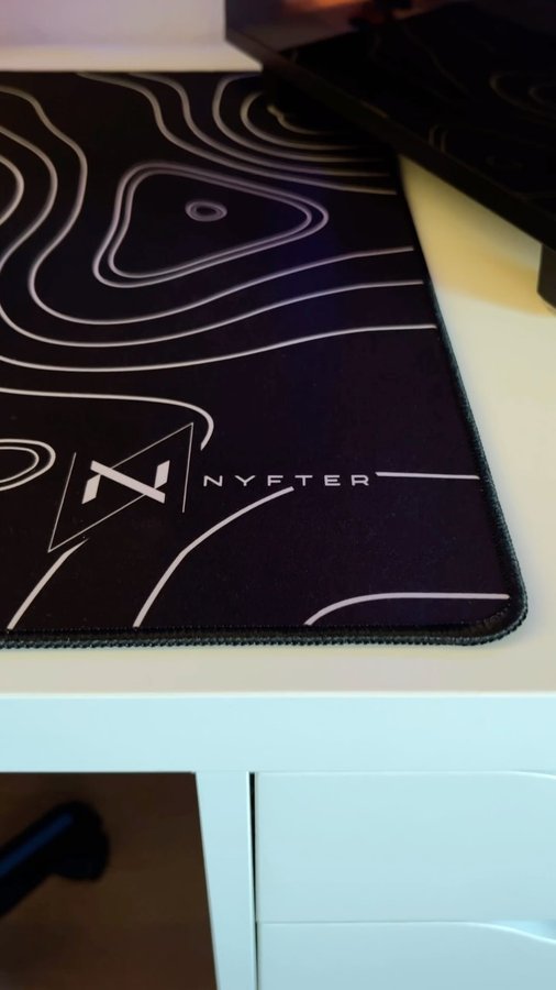 Instagram post by @henry.evr for nyfter. Caption reads: Unboxing my new mousepad from @nyfter_ 
Nyfter is....