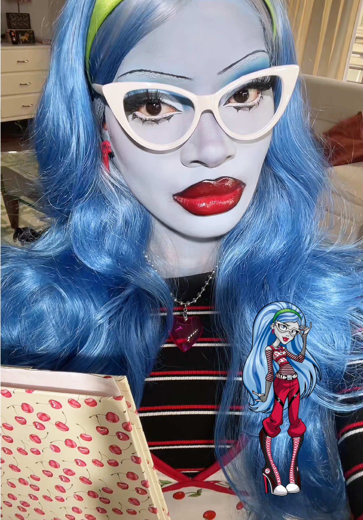 TikTok post by @isabelleikpeme for Monster High. Caption reads: ghoulia yelps! 🍒📚🧟‍♀️🧞‍♂️ @Monster High  #fyp....