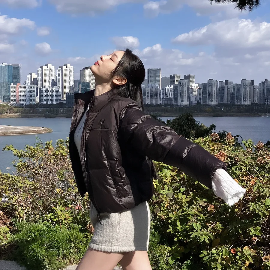 Instagram post by @yunakim for New Balance. Caption reads: 🤎 @newbalance.