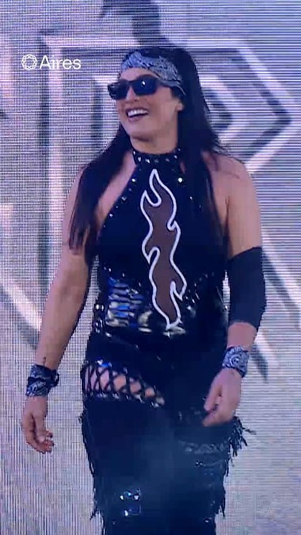 Instagram post by @raquelwwe for AiresTech. Caption reads: [...] One thing Raquel never leaves out? Her....