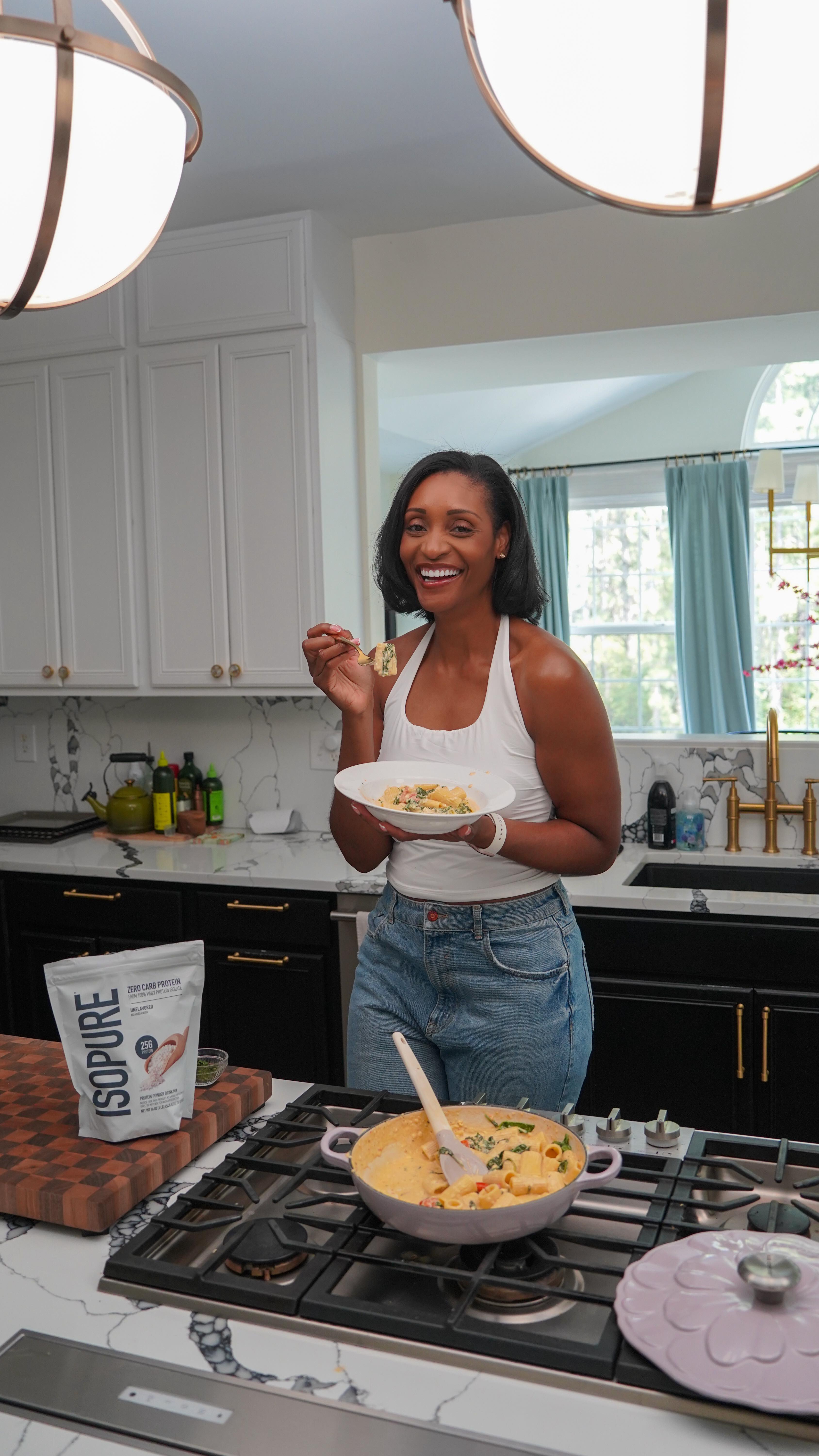 Instagram post by @natashagreene for The Isopure Company. Caption reads: #IsopurePartner This spinach tomato rigatoni is on....