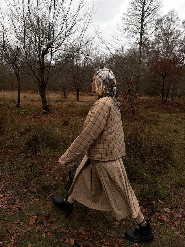 Instagram post by @jessie_bush for Barbour. Caption reads: [...] wear head to toe tartan to walk the dog....