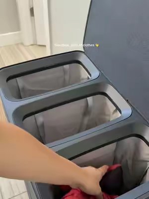 TikTok post by @jenny.cad for Songmics. Caption reads: [...] neat and organized so much easier 🤩🧺....