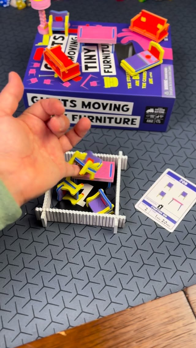 Instagram post by @woosung.boardgames for Exploding Kittens. Caption reads: I saw Giants Moving Tiny Furniture at Target and....