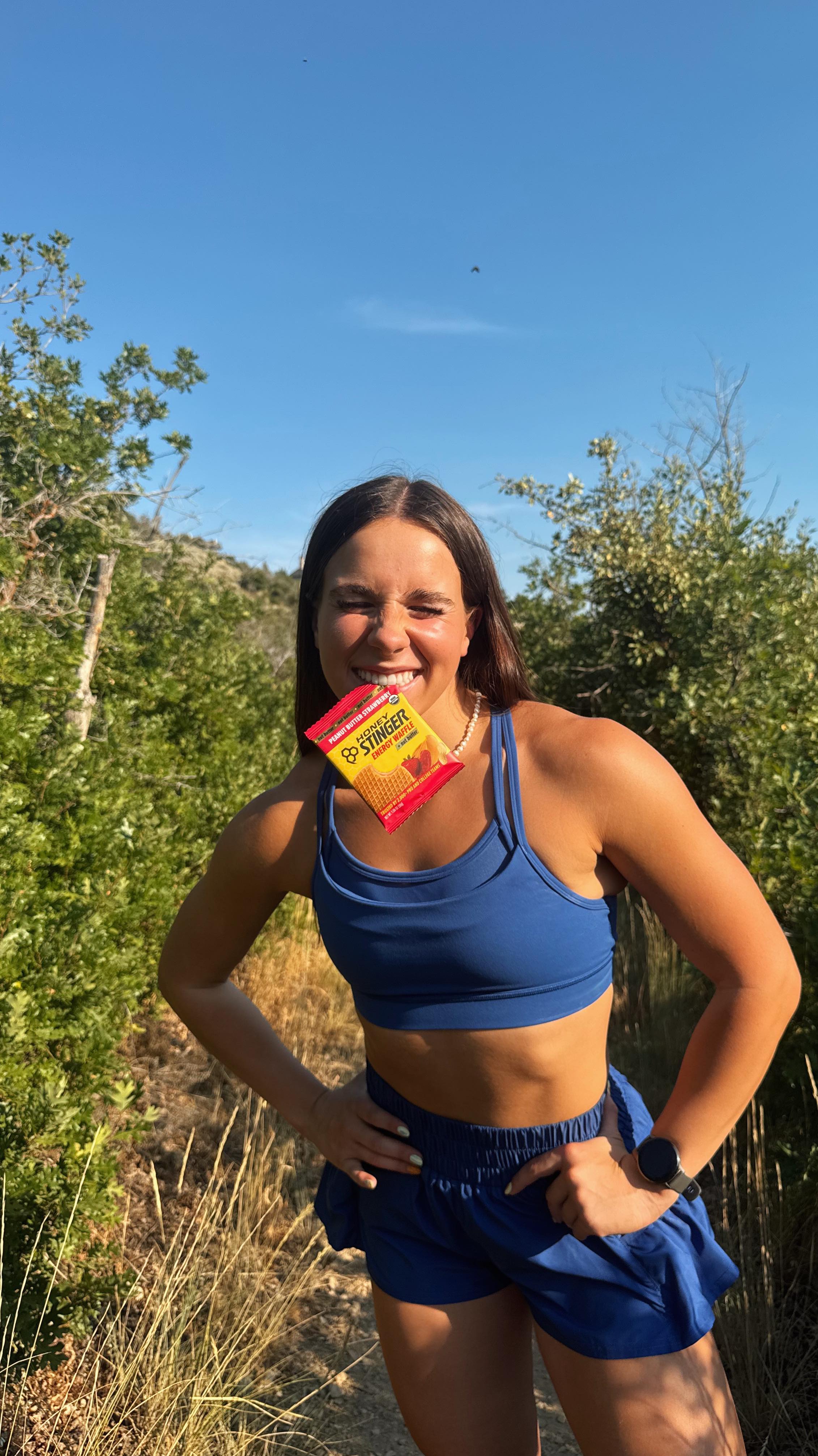 Instagram post by @lizzie.ramey for Honey Stinger. Caption reads: Nothing more inconvenient than a pocket pb&j 😪....