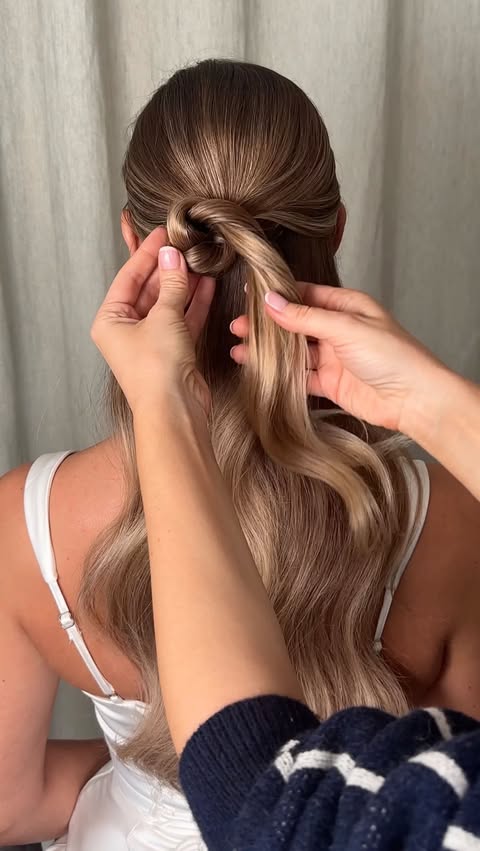 Instagram post by @kasia_fortuna for Moroccanoil Professionals. Caption reads: Give your half-up half-down a real upgrade by....