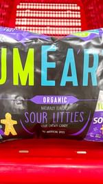 Instagram post by @targettakesmypaycheck for YumEarth. Caption reads: (#AD) RUN to Target because the new @yumearth Sour....