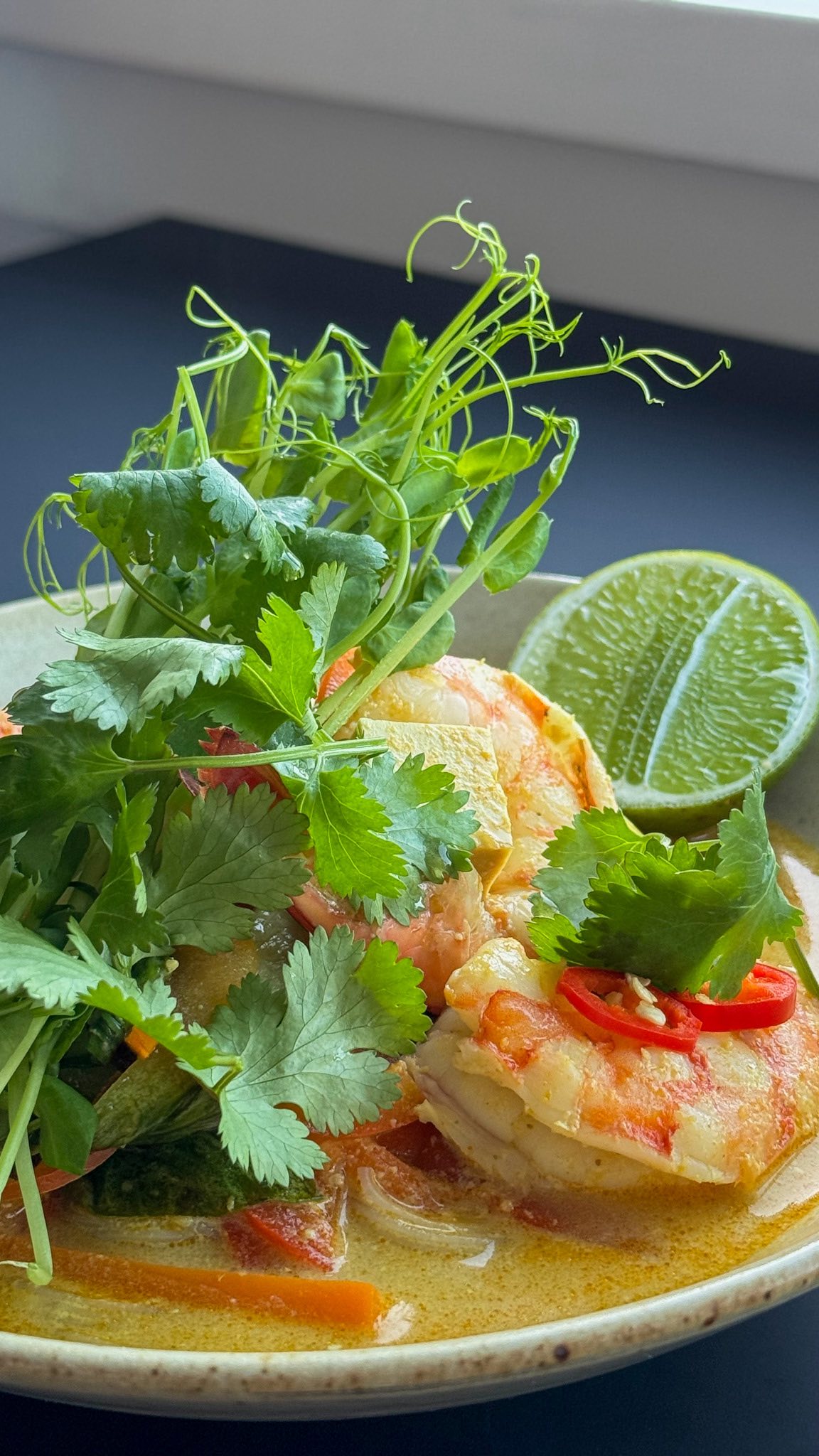 Instagram post by @brooke_kelly_nutrition for Nutra Organics. Caption reads: Prawn and Smoked Tofu Laksa 🍜 ! 

A cosy,....