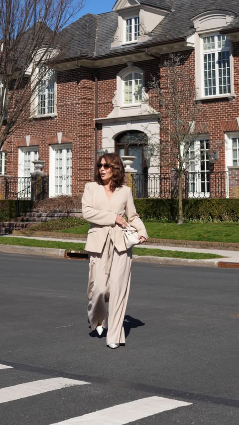 Instagram post by @olgaferrara_ny for Karen Millen. Caption reads: [...] confidence — this look from Karen Millen....