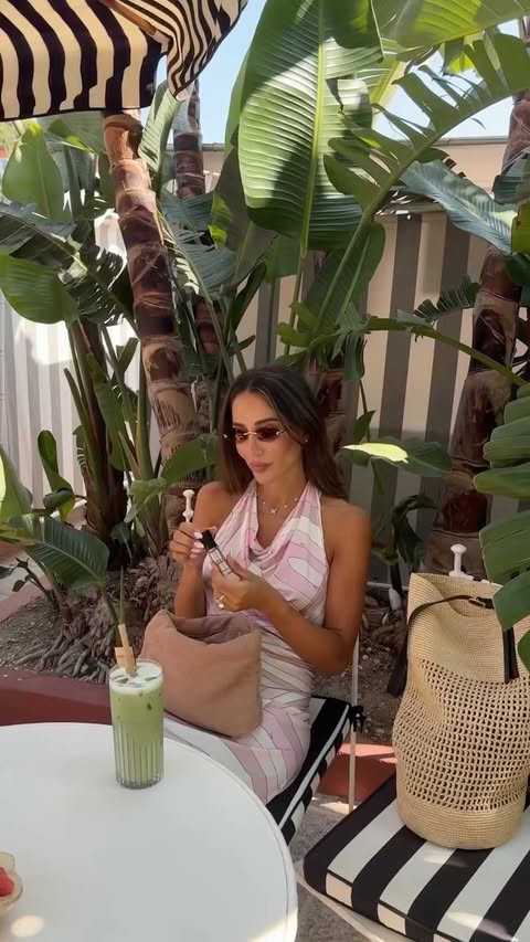 Instagram post by @tamara for Armani beauty. Caption reads: [...] Dress @emiliopucci Bag @khaite @armanibeauty....