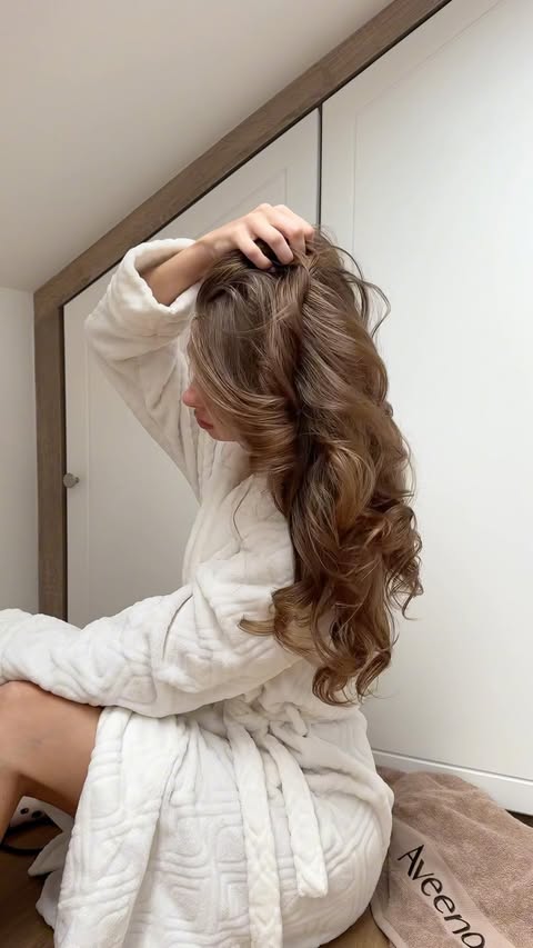 Instagram post by @nadia.bowes for Aveeno. Caption reads: [...] ofc I’ve to start with my hair lol 🍂🤎....