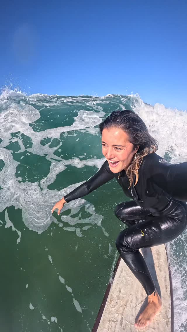 Instagram post by @naomisequeira for Intrepid Travel. Caption reads: One incredible day in the surf 🤍 Grateful for the....