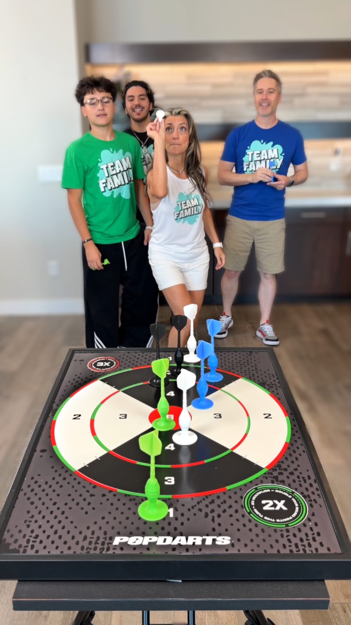 Instagram post by @gettishow for Kickstarter. Caption reads: Four Players, One Bullseye 🎯 

@popdartsgame....