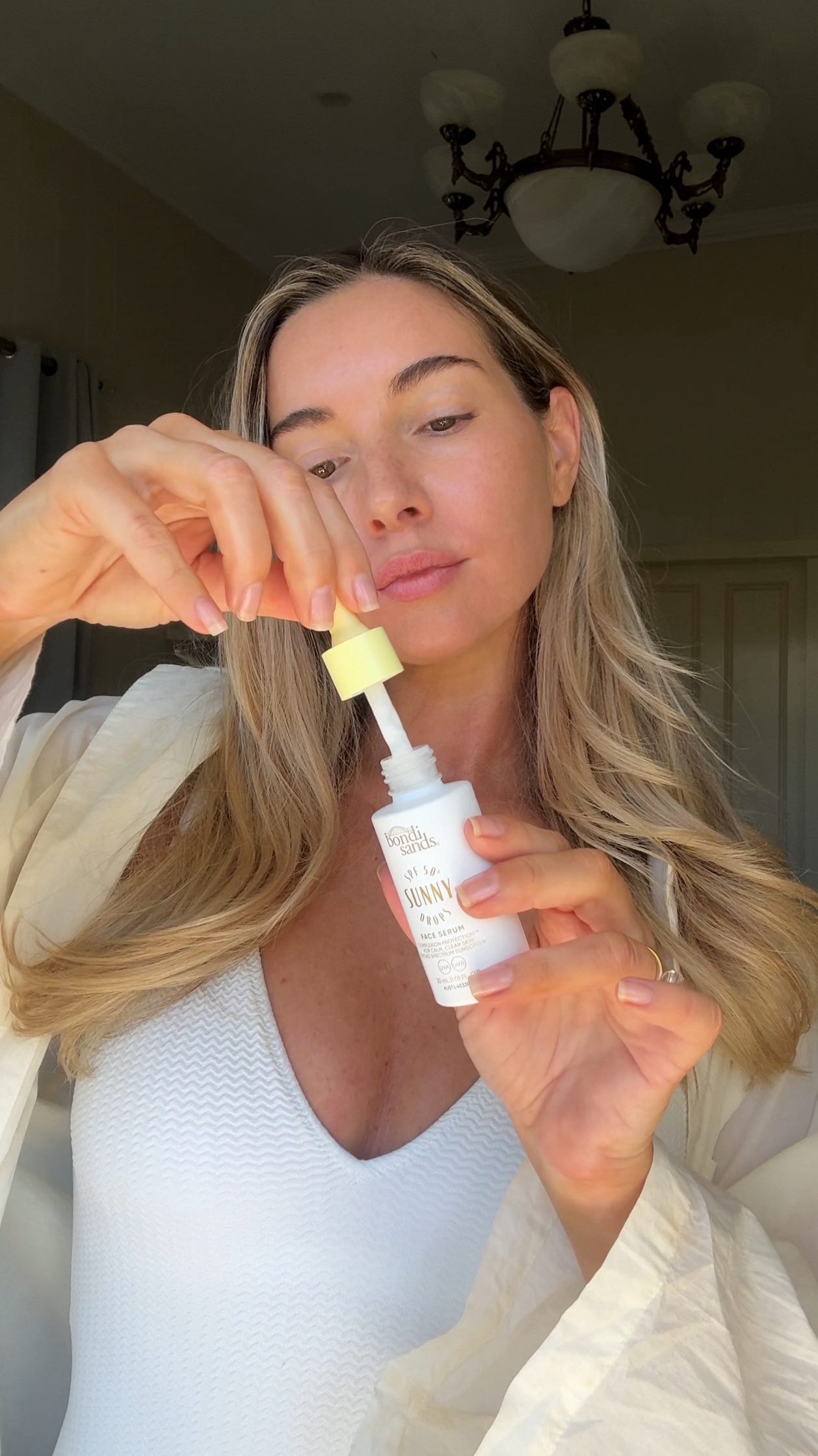 Instagram post by @becvilikas for Bondisands. Caption reads: new day, same non negotiable: SPF50+ first 🌞🐝....