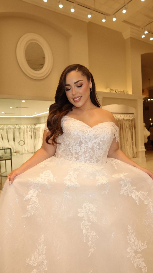 Instagram post by @superashley127 for Allure Bridals. Caption reads: Trying out the latest @allurebridals @abellabride....
