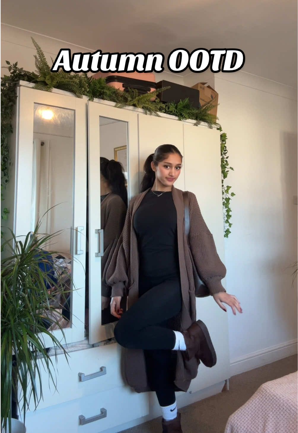 TikTok post by @sonambilkhu for emlavish. Caption reads: Brown autumn fit🐻🍂 Linked cardigan @emlavish  •....