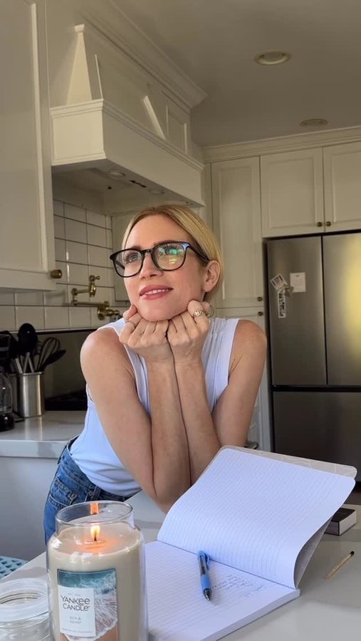 Instagram post by @brittanysnow for Yankee Candle. Caption reads: Making a gratitude list & lighting a candle is....