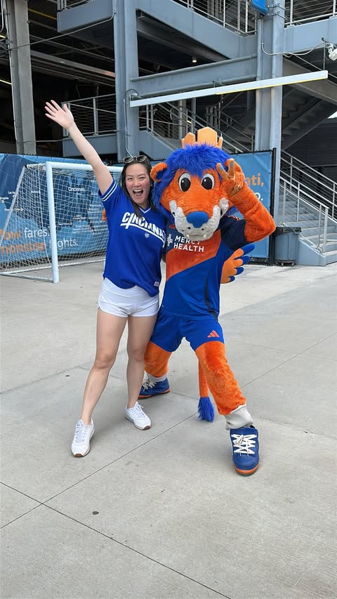 Instagram post by @drinkingdiningdione for Allegiant Air. Caption reads: [ sponsored ] @fccincinnati ‘s game 💙🧡⚽️ on....