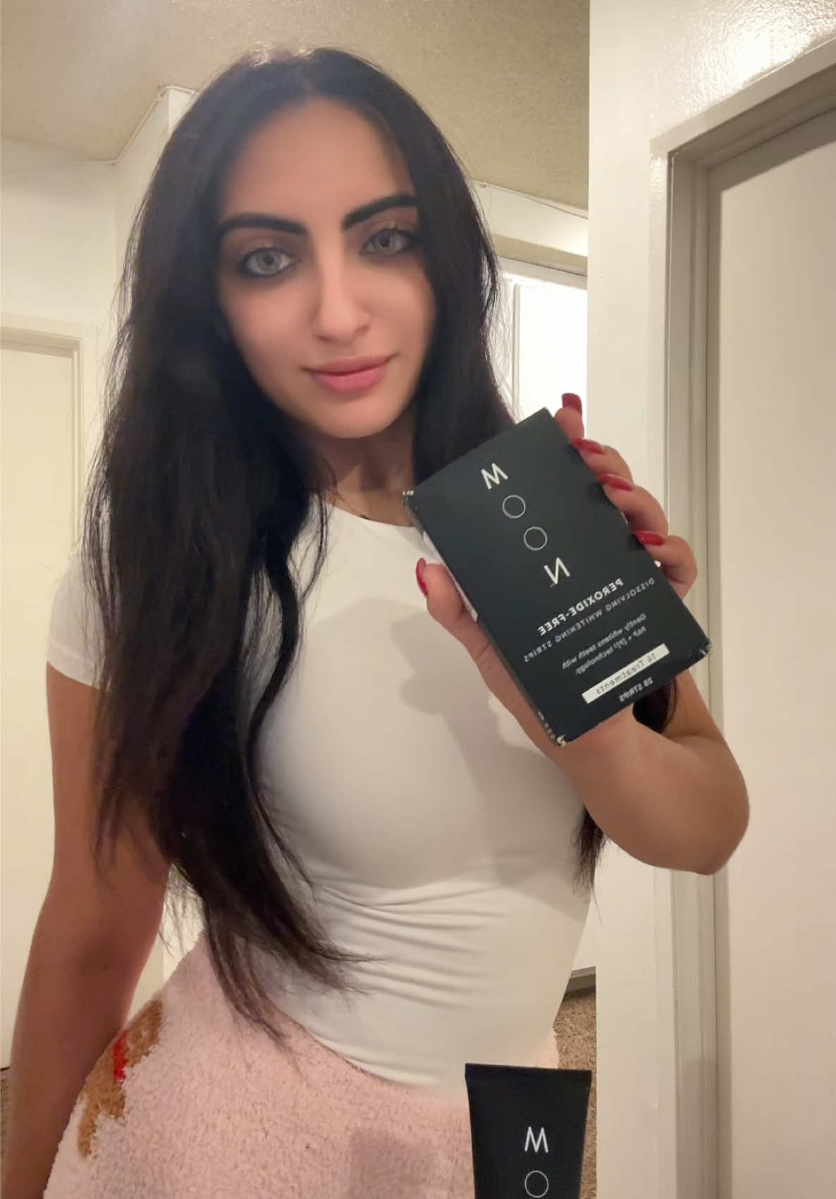 TikTok post by @arabbdoll for MOON Oral Beauty. Caption reads: [...] ✨🤍 Keeping my smile bright with @Moon Oral....