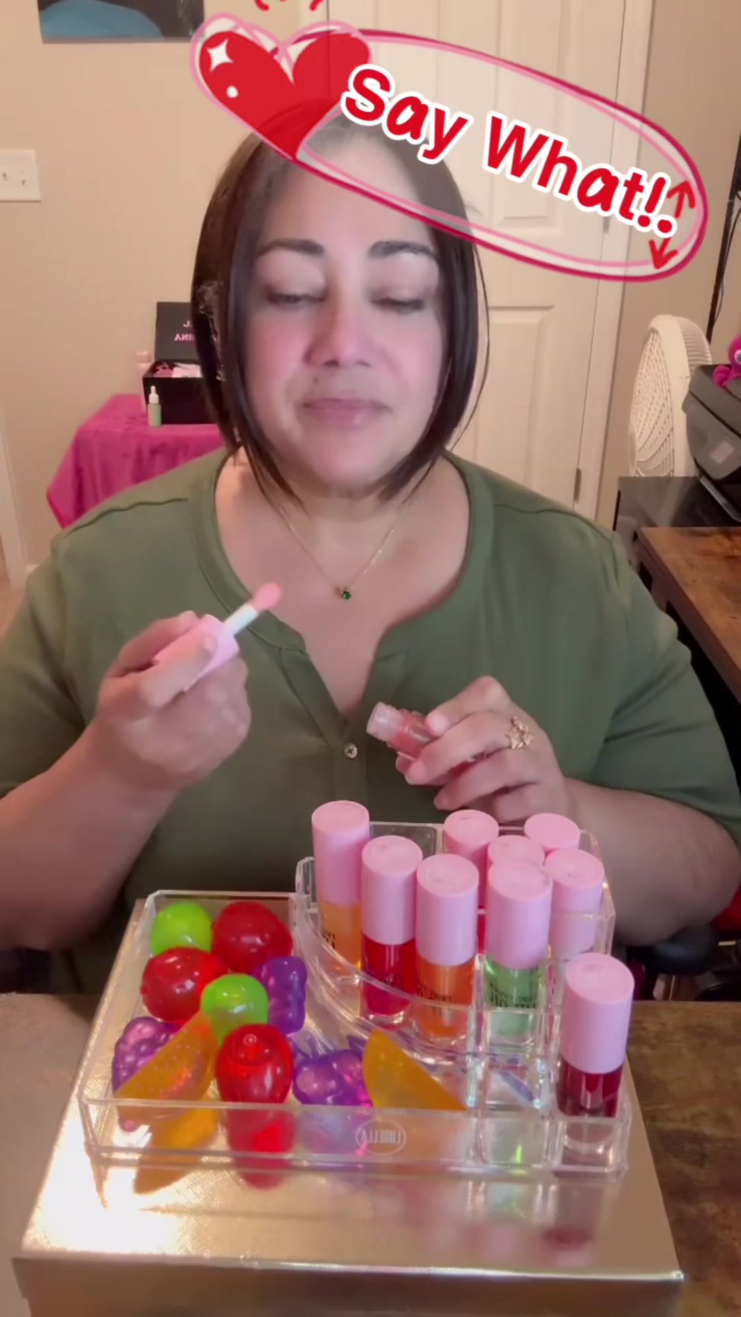 TikTok post by @johannaliz73 for Lurella Cosmetics. Caption reads: [...] lip oils hit different 🍓🥥🍊....