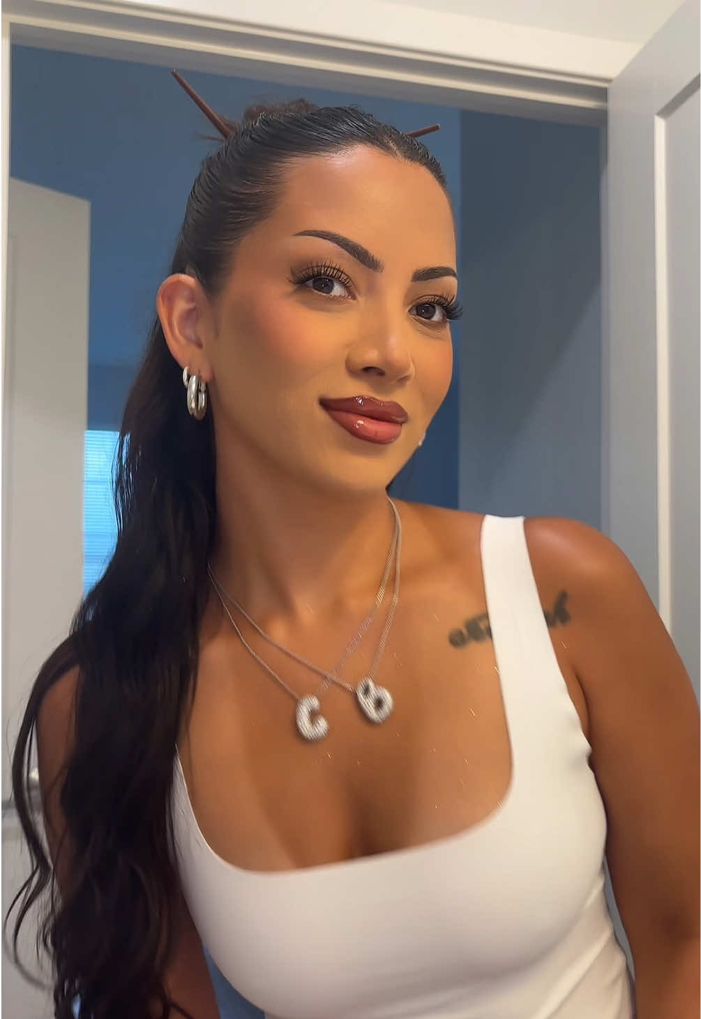 TikTok post by @ambervcruz for Eva NYC. Caption reads: Best body glitter I’ve ever used! Not sticky at....