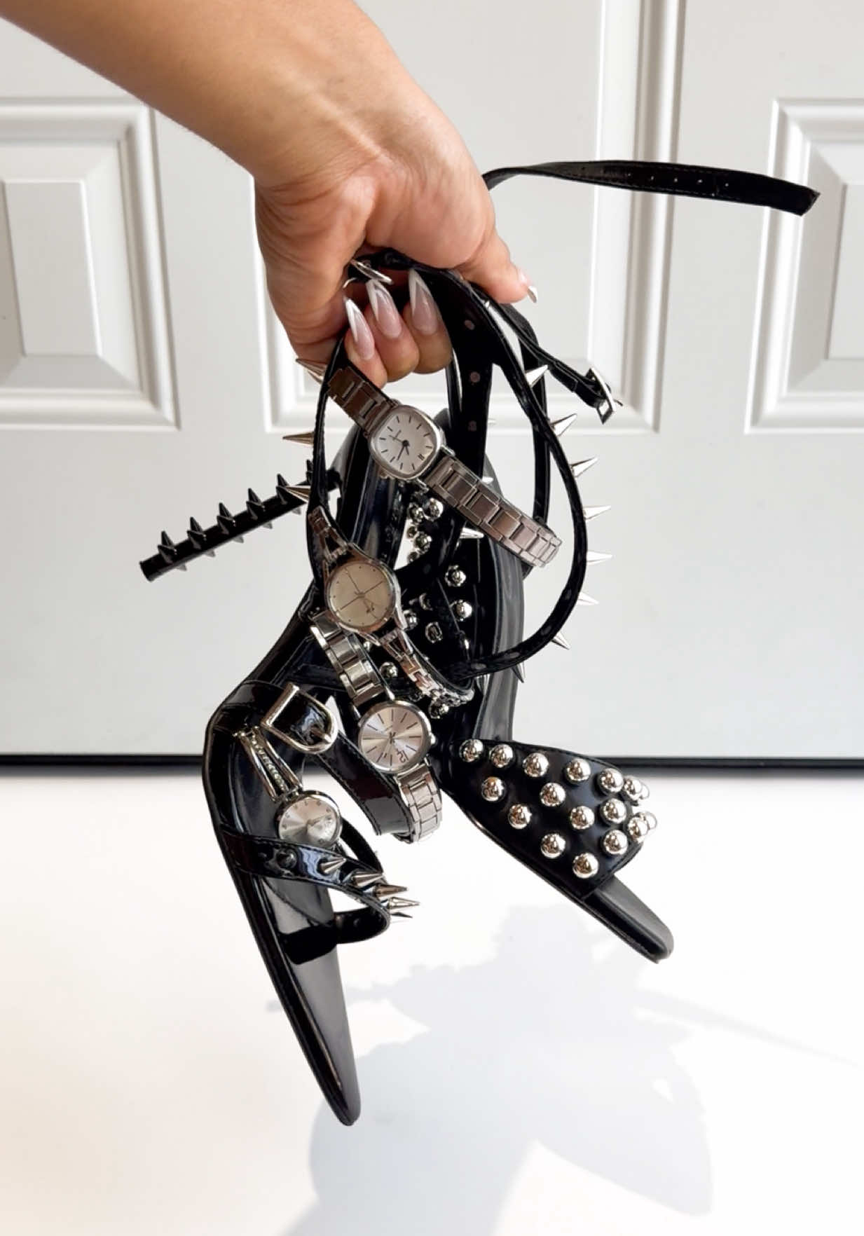 TikTok post by @aliseamora for AZALEA WANG. Caption reads: [...] top black heels + boots from @AKIRA x....