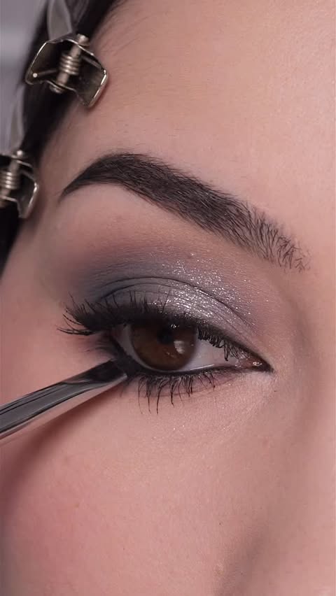 Instagram post by @ashleykaylamakeup for Morphe. Caption reads: Silver eyeshadow look tutorial for the holiday....