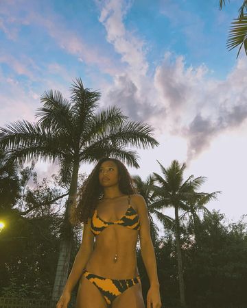 Instagram post by @matayasweeting for Icon Swim. Caption reads: Survival instincts🐯@iconswim #iconswim 
🌸Want to....