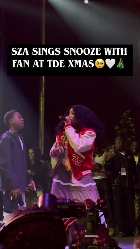 Instagram post by @jcruzshow for iHeartRadio. Caption reads: CUTE ALERT! @sza SANG WITH A YOUNG FAN AT....