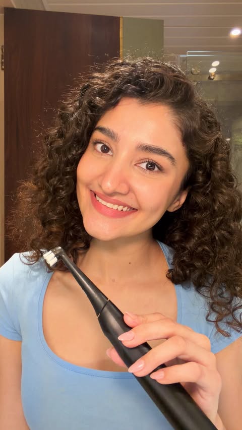 Instagram post by @devika.26 for Oral-B. Caption reads: Plugged into better brushing 💁🏻‍♀️ #Ad....