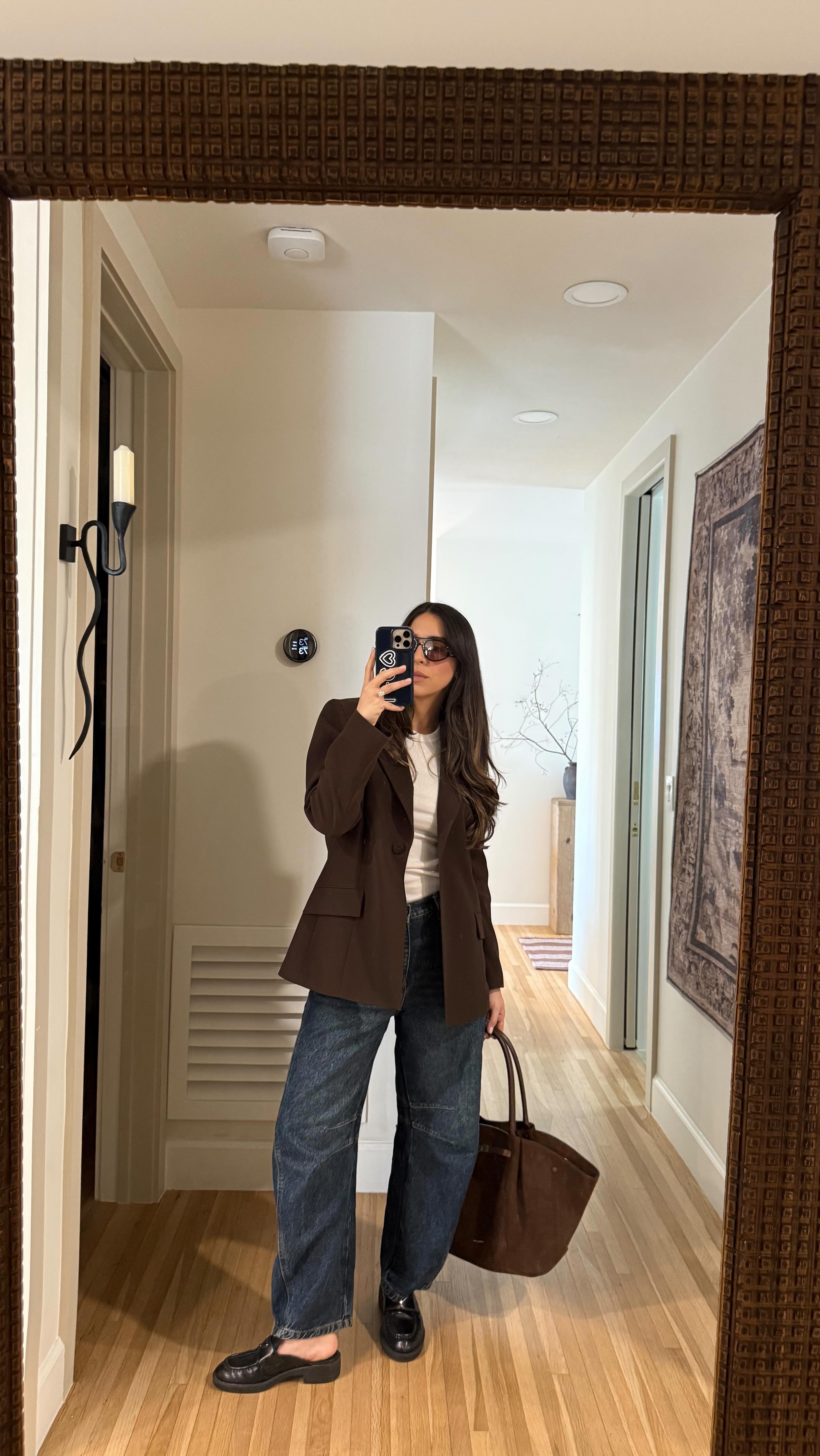 Instagram post by @lauramvila for thredUP. Caption reads: answering some of your thrifting questions 🤌🏼....