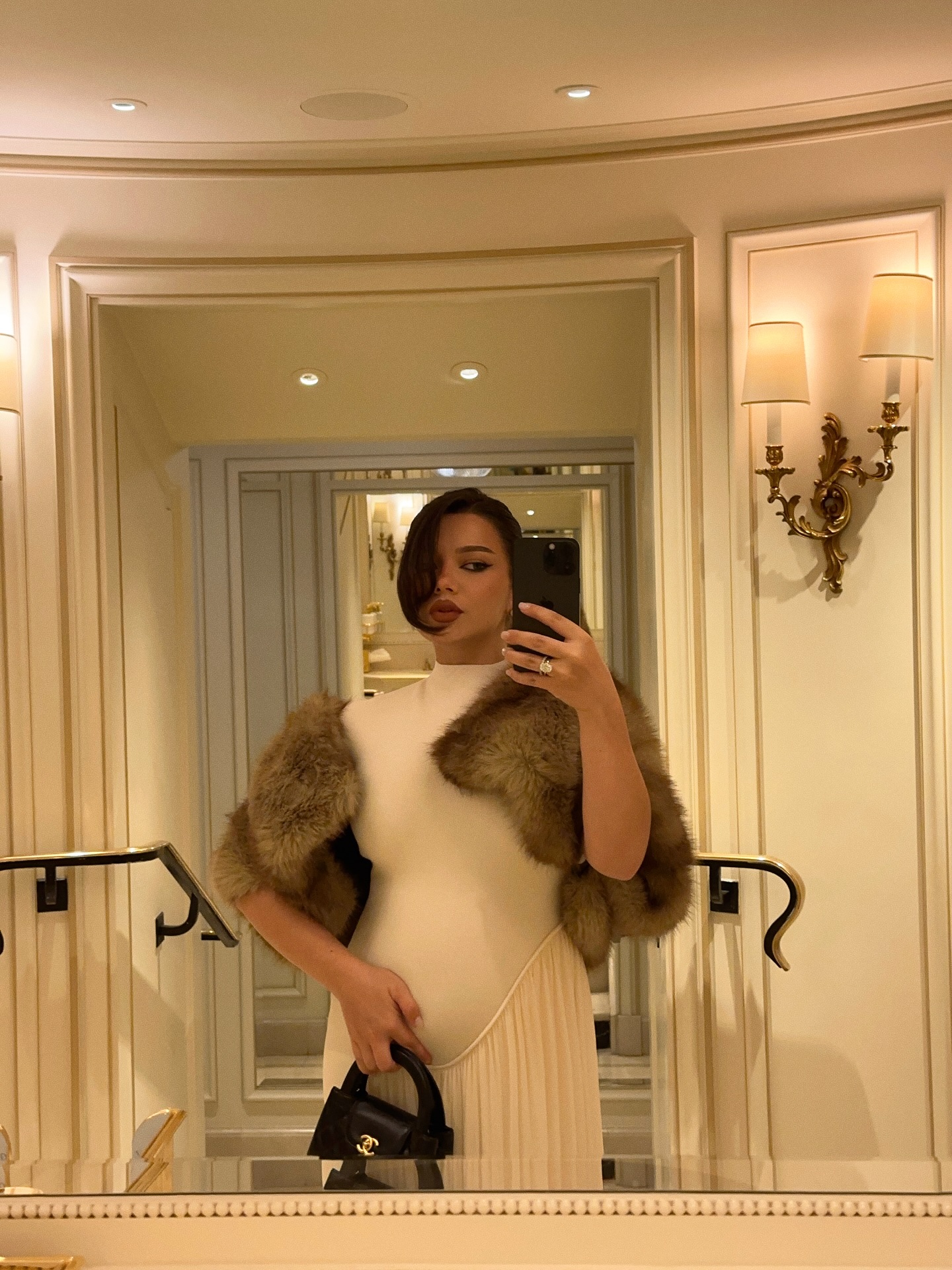 Instagram post by @michaelaberdaga for REVOLVE. Caption reads: PFW was all about maternity chic this....