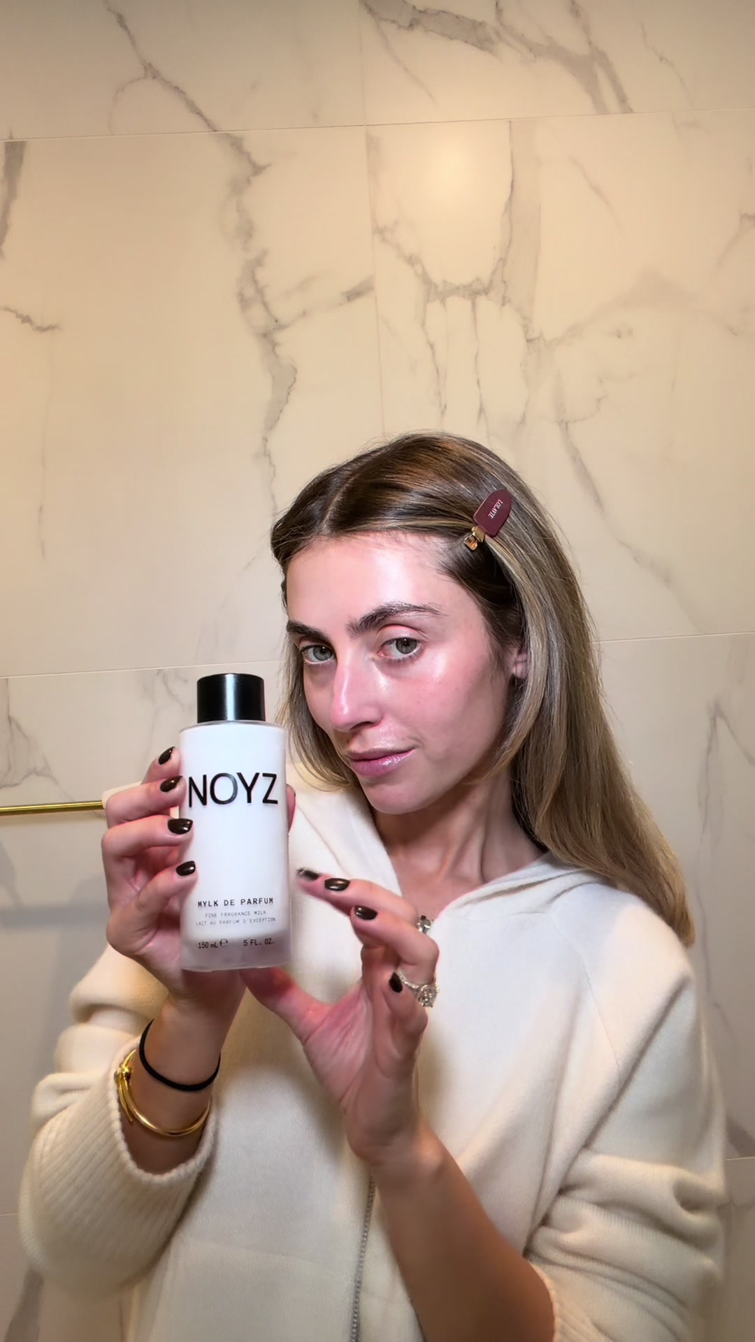 TikTok post by @charlottehbickley for NOYZ. Caption reads: MYLK De Parfum by @noyzfragrance is my first step....